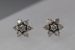 A pair of diamond flower stud earrings