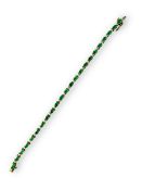 An emeralds and diamonds line bracelet, mounted yellow metal stamped in 14k