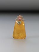 A butter scotch amber and coloured stone pendant