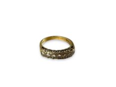 A seven stone diamond ring, mounted in 9k gold