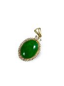 A bright apple green Jadeite and Diamond pendant mounted in 18k yellow metal