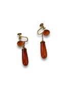 A Pair of Amber pipkin drop screw-on earrings, circa 1900s