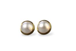 A pair of mabe pearl earrings, set in 9ct gold
