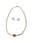 A vintage-style necklace and matching clip-on earrings mounted in 18k gold.