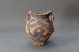 A Chinese Painted Pottery Handled Vase, Neolithic Period
