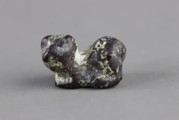 A Miniature Bronze Bead formed as a Seated Feline, Eastern Iran, Bronze Age