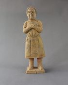 A Chinese Pottery Figure of a Man, with well modelled Face, Tang dynasty