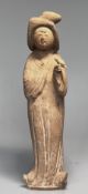 A Chinese pottery figure lady with a bird, Tang dynasty.