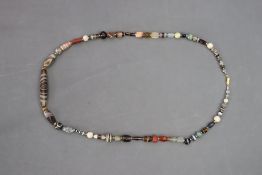 A slender Banded Agate and Dzi stone Bead Necklace of Tibetan type