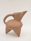 A Red Pottery Tripod Ewer, Neolithic period, Dawenkou culture, c. 4300-2400 BC