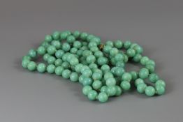 A Green Pekin Glass Bead Necklace imitating Jadeite, c.1920,