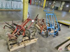 (2) Skids Of Oil Drum Hand Trucks