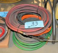 Lot-Air Hoses in (1) Stack Under (1) Table