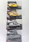 Four boxed Carrera Evolution slot cars,