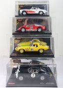 Four boxed Carrera Exclusiv slot cars,