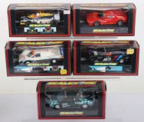 Five boxed Scalextric slot cars,
