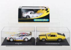 Three boxed Scalextric slot cars,