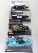 Four boxed Carrera Evolution slot cars,