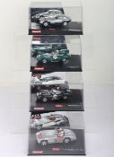 Four boxed Carrera Evolution slot cars,
