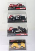 Four boxed Ninco 1:32 scale slot cars,