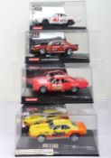 Four boxed Carrera Evolution slot cars,