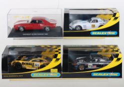 Four boxed Scalextric slot cars,