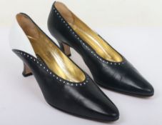 Escada black and white heels with punch out holes around trim