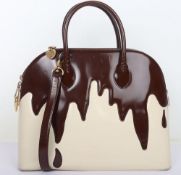 Moschino “Let them eat cake” handbag