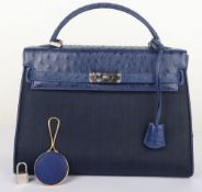 William & Son Blue Ostrich Leather Handbag with Vanity Accessory - Including mirror. Circa 2008.