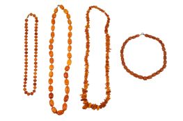 FOUR AMBER NECKLACES