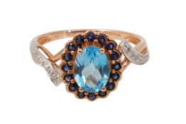 A TOPAZ, SAPPHIRE AND DIAMOND RING
