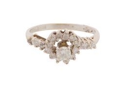 A 14CT GOLD AND DIAMOND HALO RING, CIRCA 1969