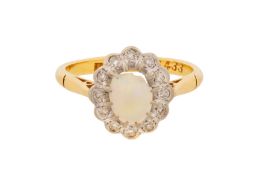 A WHITE OPAL AND DIAMOND HALO RING