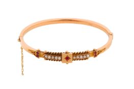 A 9CT ROSE GOLD GEM-SET AND SEED PEARL BANGLE