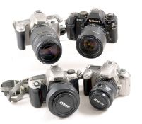 Four Nikon AF Film Cameras with Zoom Lenses.