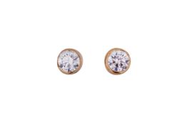 A PAIR OF DIAMOND STUDS