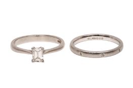 A DIAMOND SINGLE-STONE RING TOGETHER WITH A WEDDING BAND