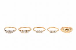 A COLLECTION OF THREE-STONE DIAMOND RINGS