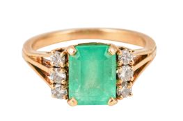 AN EMERALD AND DIAMOND RING