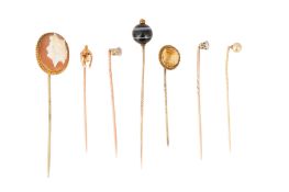 A COLLECTION OF SEVEN STICK PINS