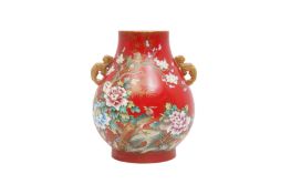 A CHINESE CORAL-GROUND FAMILLE-ROSE 'BIRDS AND FLOWERS' VASE, HU