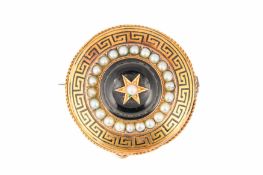 A MID 19TH CENTURY ONYX AND SEED PEARL MOURNING BROOCH
