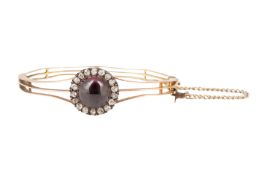 AN AMETHYST AND DIAMOND BANGLE