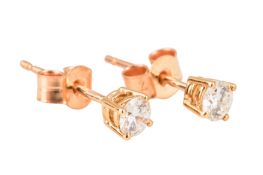A PAIR OF DIAMOND STUD EARRINGS