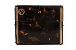 An early 20th century unmarked gold mounted tortoiseshell cigarette case