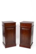 A pair of 19th Century mahogany plinth cupboards
