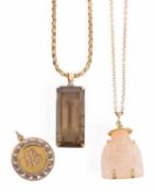 A 14K gold smoky quartz pendant on a 14K gold chain