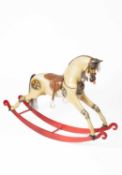 A Victorian style painted rocking horse