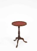 A small tripod wine table