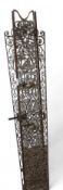 A pair of decorative metal gates, with scroll work